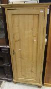 A pine single door wardrobe with three shelves, on turned legs CONDITION REPORTS Approx 179cm