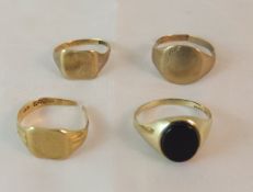 Two 9 carat gold signet rings, together with two further rings CONDITION REPORTS Three rings very