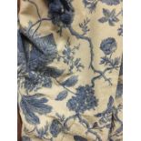 Two pairs of cotton lined curtains with printed blue and cream floral design and some spare material