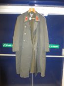 A German full length coat with red lapel