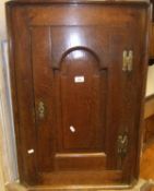 An oak wall hanging single door corner c