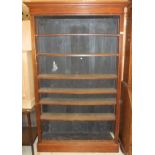 A mahogany veneered seven shelf adjustable open bookcase on simple plinth base CONDITION REPORTS