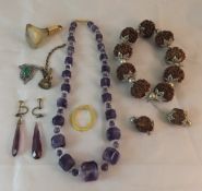 A facet cut amethyst and glass bead neck