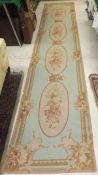 An Aubusson style stitched runner, the f