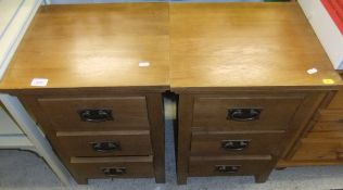 A modern pair of oak three drawer bedsid