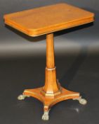 A modern burr walnut veneered rectangular pedestal occasional table with gilt embellishments, raised