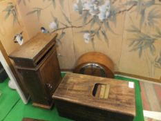 An oak key cupboard with posting box top