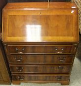 A modern yew effect four drawer bureau o