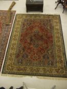 A Persian style machine made carpet, the