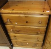 A pine chest of four long drawers with t