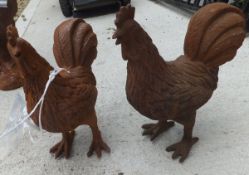 Two cast iron chickens *