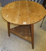 A pine two tier cricket table in the ear
