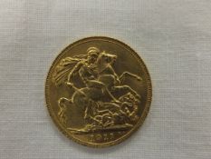 A George V 1911 gold sovereign CONDITION REPORTS Weight approx 8g.  General wear and scuffs.