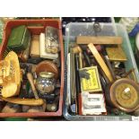 A basket and crate of sundry treen ware including rulers, shoe trees, draughts pieces, walnut