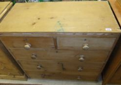 A pine chest of two short and three long