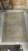 An Oriental rug with central diamond sha