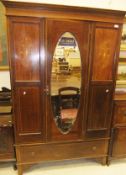 An Edwardian mahogany and inlaid single mirror door wardrobe with drawer CONDITION REPORTS Approx