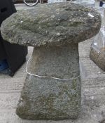 A stone staddle stone with four sided ta