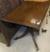 A reproduction mahogany drop-leaf D-end dining table on centre pedestal to quadruped base