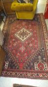 A Caucasian rug, the central diamond medallion in cream,