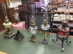 A collection of five various oil lamps w