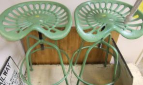 Two tractor seat bar stools *