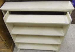 Two cream painted open book shelves