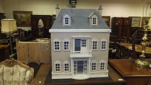 A three storey doll's house with balustr