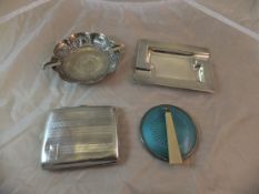 A modern silver ashtray with engine turned decoration, a silver cigarette case,