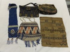 A box containing assorted circa 1900 and later lace work, an un-framed sampler depicting alphabet