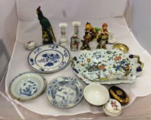 Two Chinese porcelain bowls, a pottery figure of a pheasant, an Oriental figure of a cockerel, a