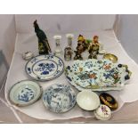 Two Chinese porcelain bowls, a pottery figure of a pheasant, an Oriental figure of a cockerel, a
