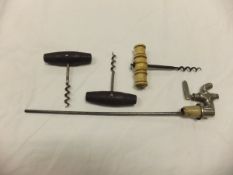 Two French pull corkscrews with turned w