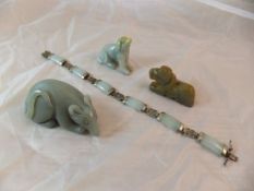 A carved jade figure of a rat, together