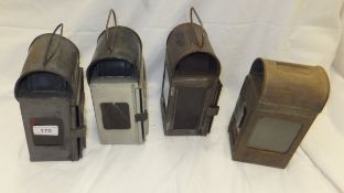 A collection of four railway lamps