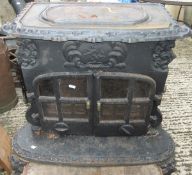 A cast iron wood burner with two glazed