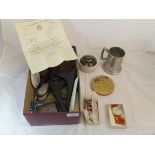 A box containing a silver cigarette case, two Fire Service medals from the 1950's with