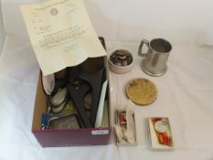 A box containing a silver cigarette case, two Fire Service medals from the 1950's with