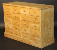 A pine chest of 20 drawers with turned h
