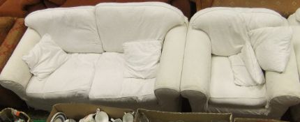 A modern scroll arm two seater sofa with