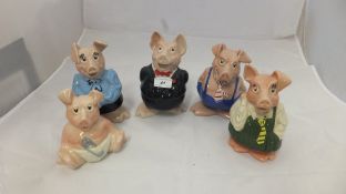 A set of five Wade Nat West piggy banks,