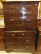 A George III mahogany chest on chest, the upper section with moulded cornice over two short and