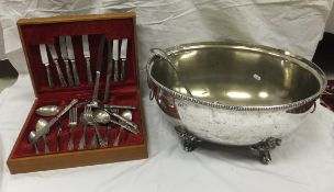 A plated punch bowl with cast lion head