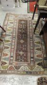 A Turkish rug, the centre madder field d