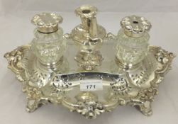 A large Victorian silver inkstand set with two cut glass inkwells, with silver mounts and a