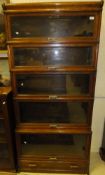 An early 20th Century Globe Wernicke five section bookcase with single drawer base