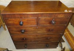 A mahogany chest of two short and three long drawers with turned wooden handles