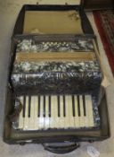 An Alvari twelve button two octave piano accordion,