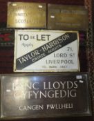 A collection of four vintage metal signs to include a copper and brass sign inscribed "Banc Lloyds