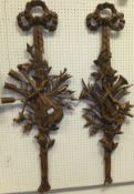 A pair of stained resin wall decorations as flowers,